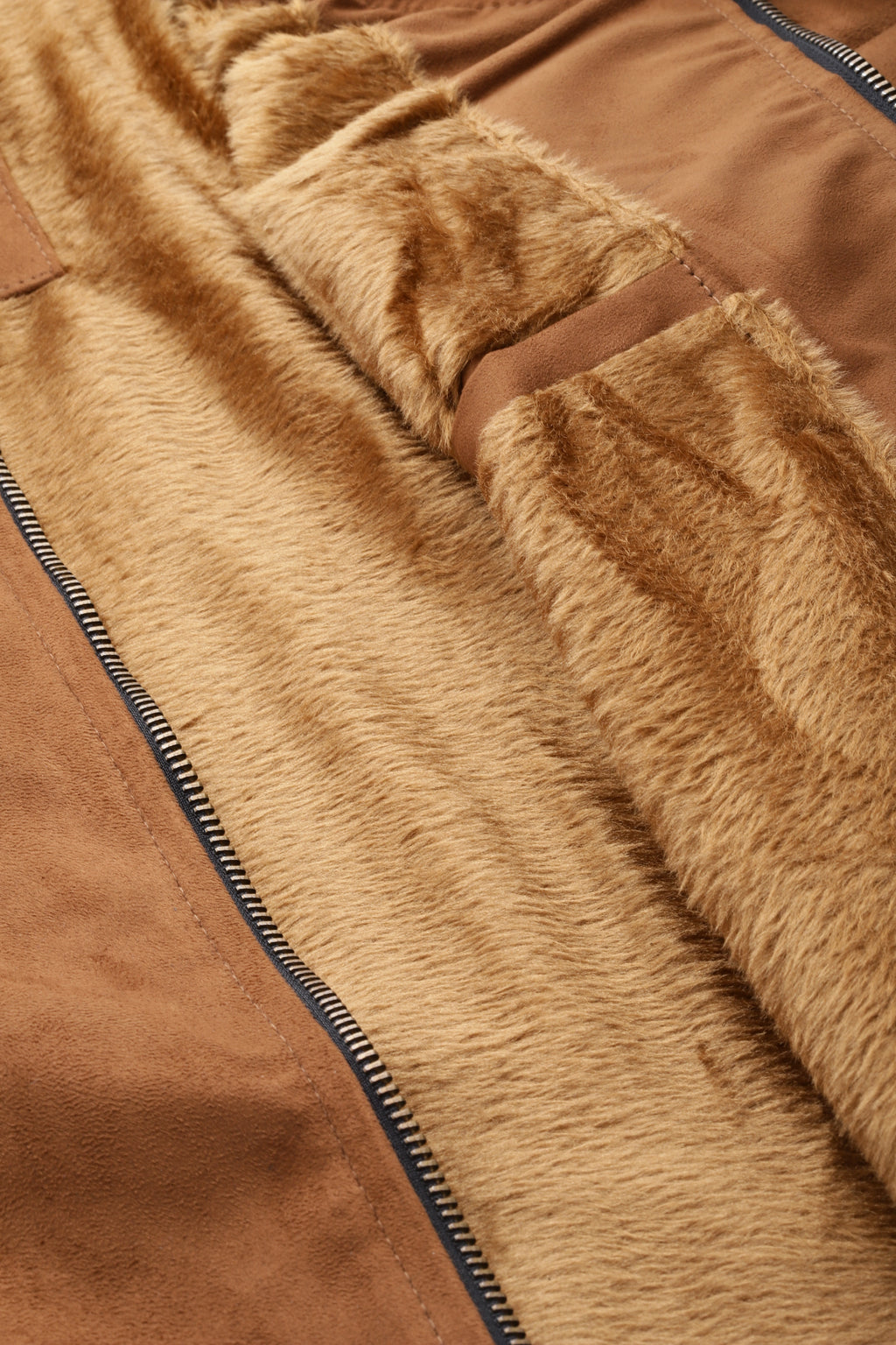 Close-up of the soft interior lining of a stylish men's jacket made of faux suede material.